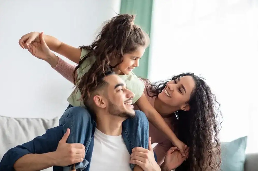 A family celebrating getting relief from financial hardship