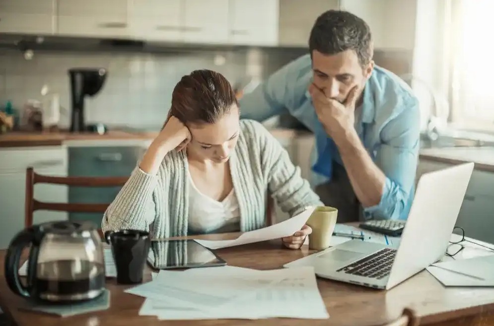 A couple working through financial hardship together