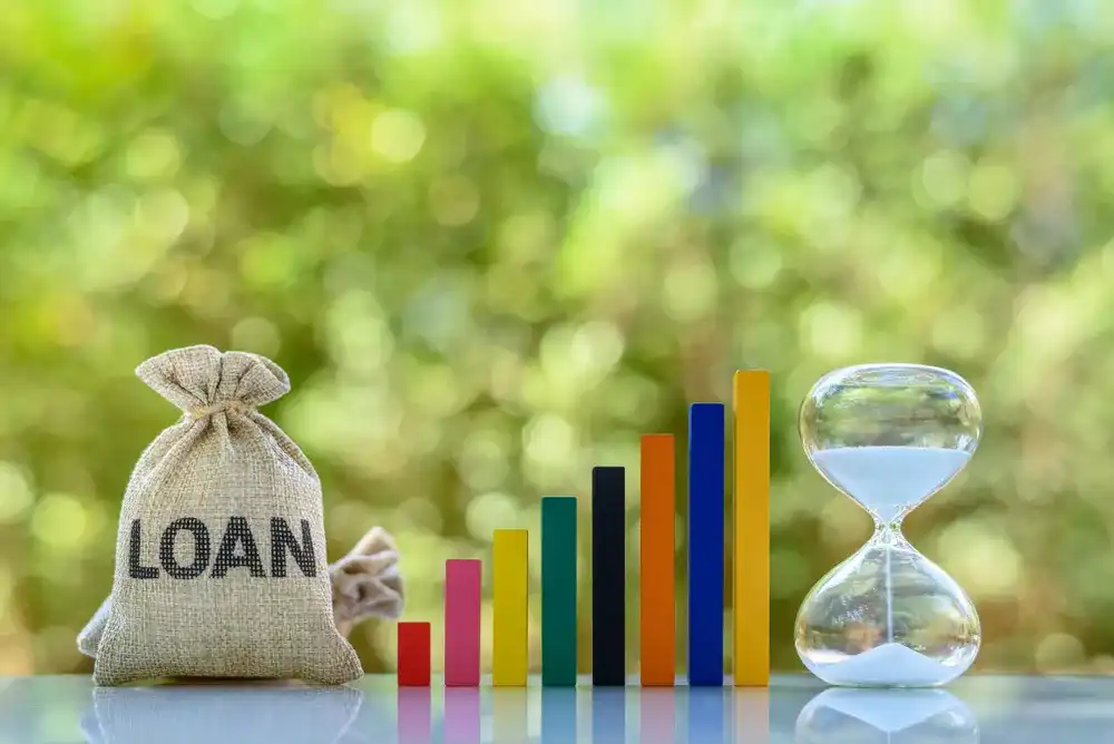 Hourglass next to a loan