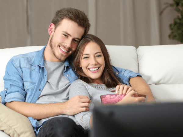 Young couple choose to save money and have a date night at home