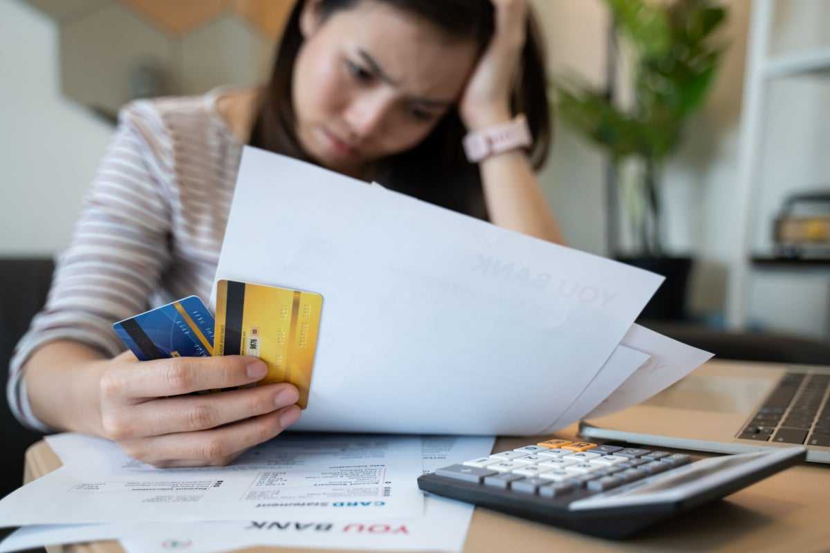 Woman reviewing her credit and how she can improve it