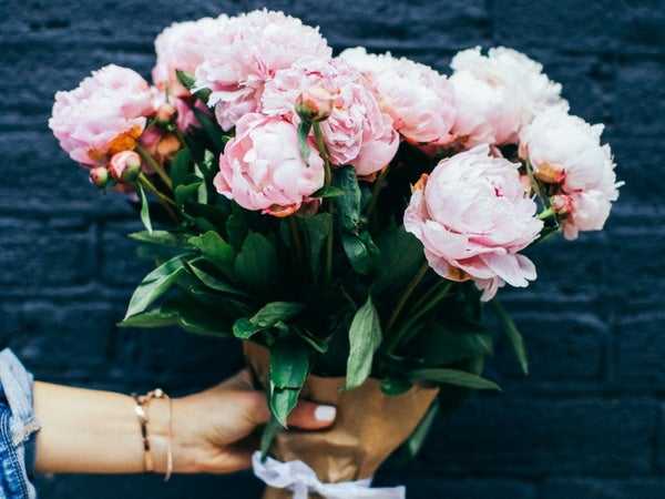 Women holding a bouquet of flowers for a Mother's day gift