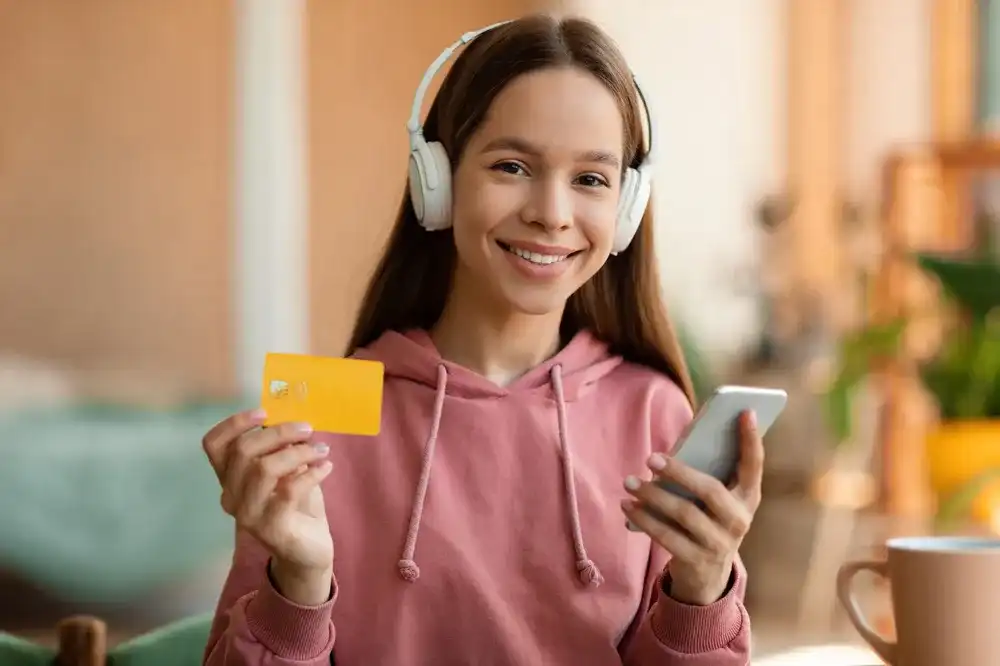 A teenage girl using online financial education tools