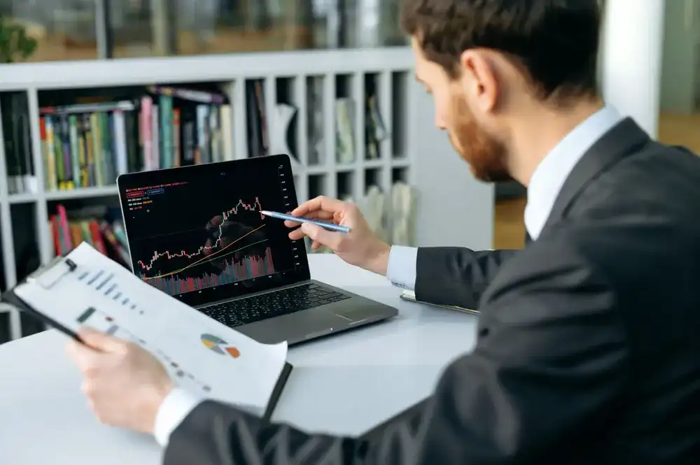 Man researching market expansion on his laptop