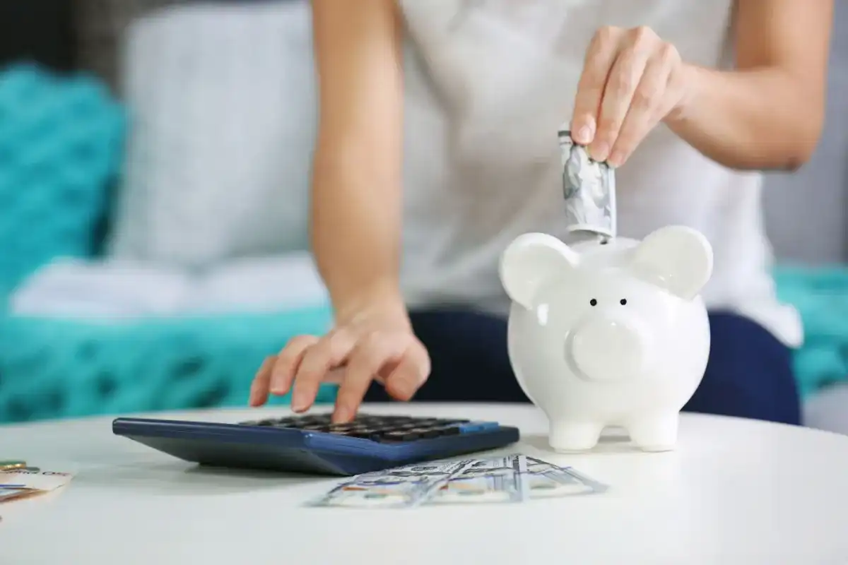 A woman diversifying their income to mitigate the impact of potential job losses or reduced income during a recession