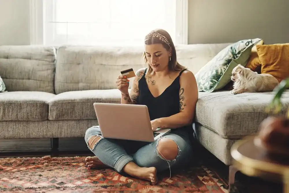 A Gen Z woman shopping online with her credit card