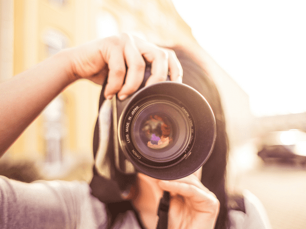 females photographer taking a picture 