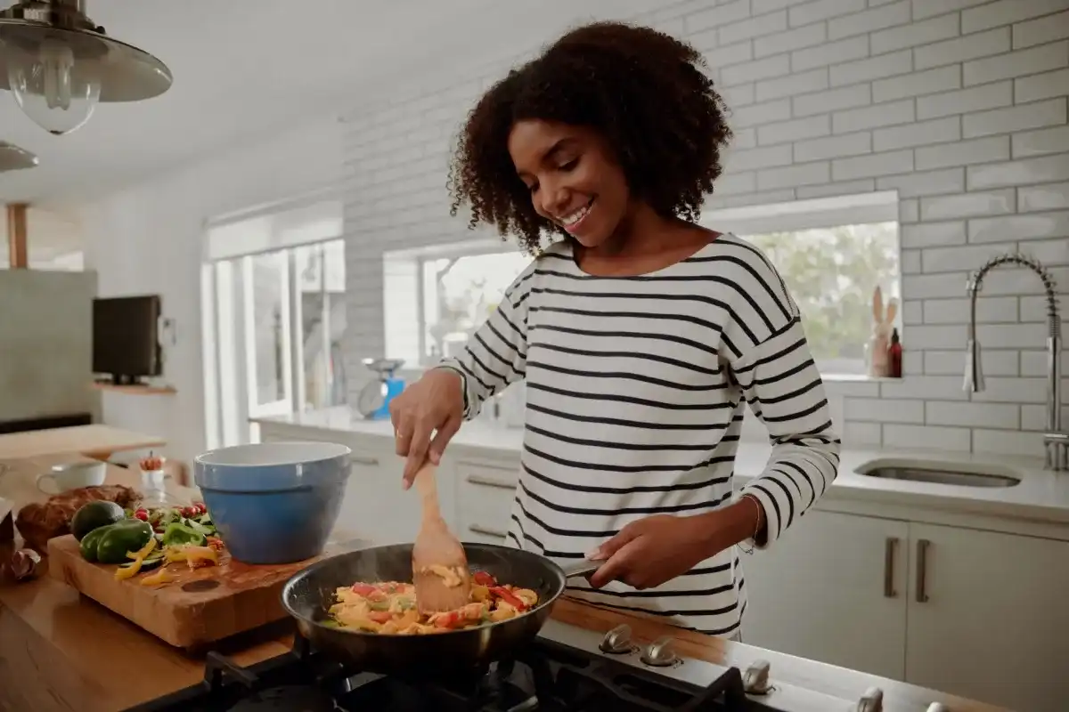 A college student cooking a budget-friendly meal
