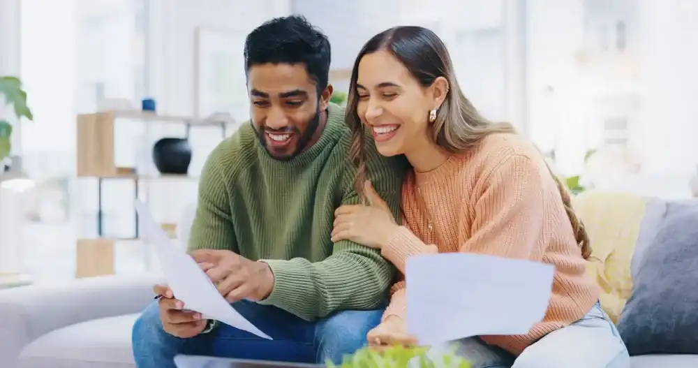 A couple celebrating their improved credit score