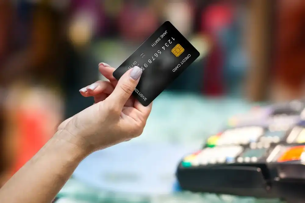 Person using the credit card they had applied for