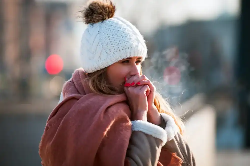 Woman staying warm in cold weather