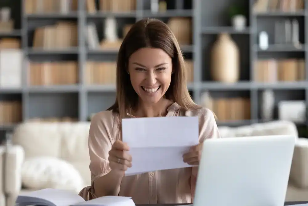 A woman receiving her gas rebate check in the mail