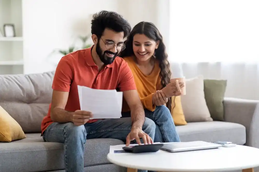 A couple reviewing their finances and their growth trends