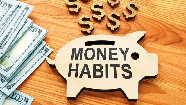 A sign that reads "Money Habits"