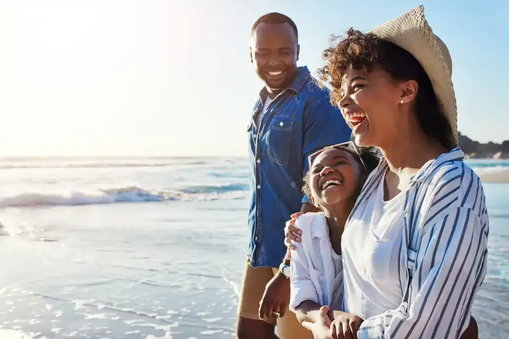 A family enjoying a vacation to the beach together