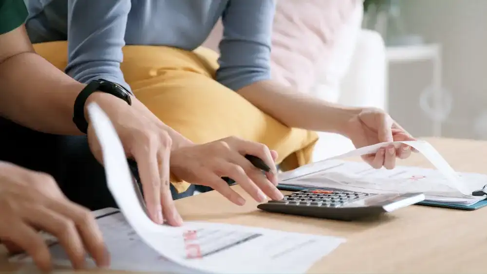 A couple figuring out how much to save for emergencies