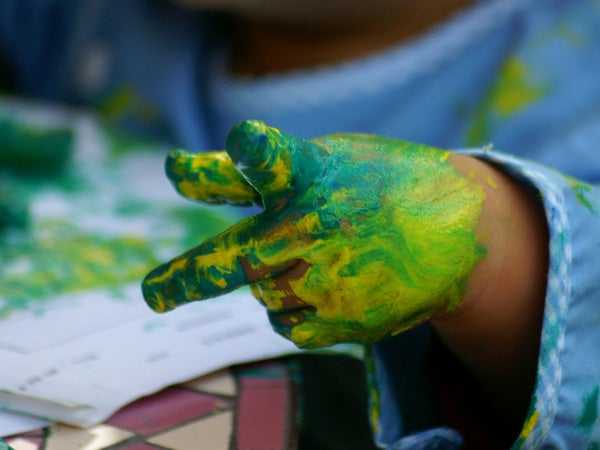 child finger painting