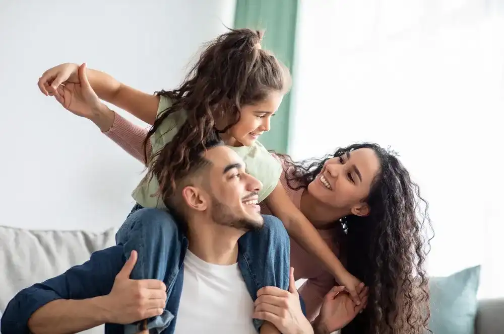 A family celebrating getting relief from financial hardship