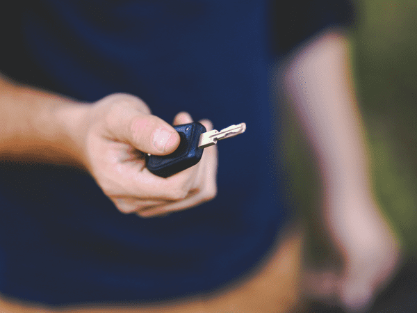 Man holding keys to apply for a title loan 