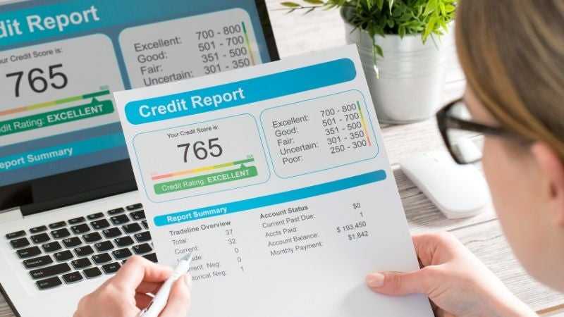 Woman reviewing her credit report to qualify for an installment loan 