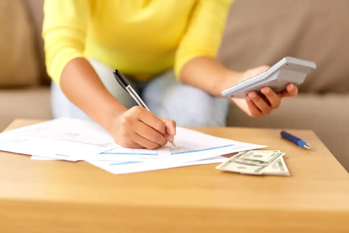 Woman paying off her credit cards