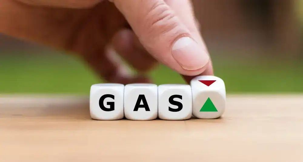 Someone playing with dice that read "Gas"