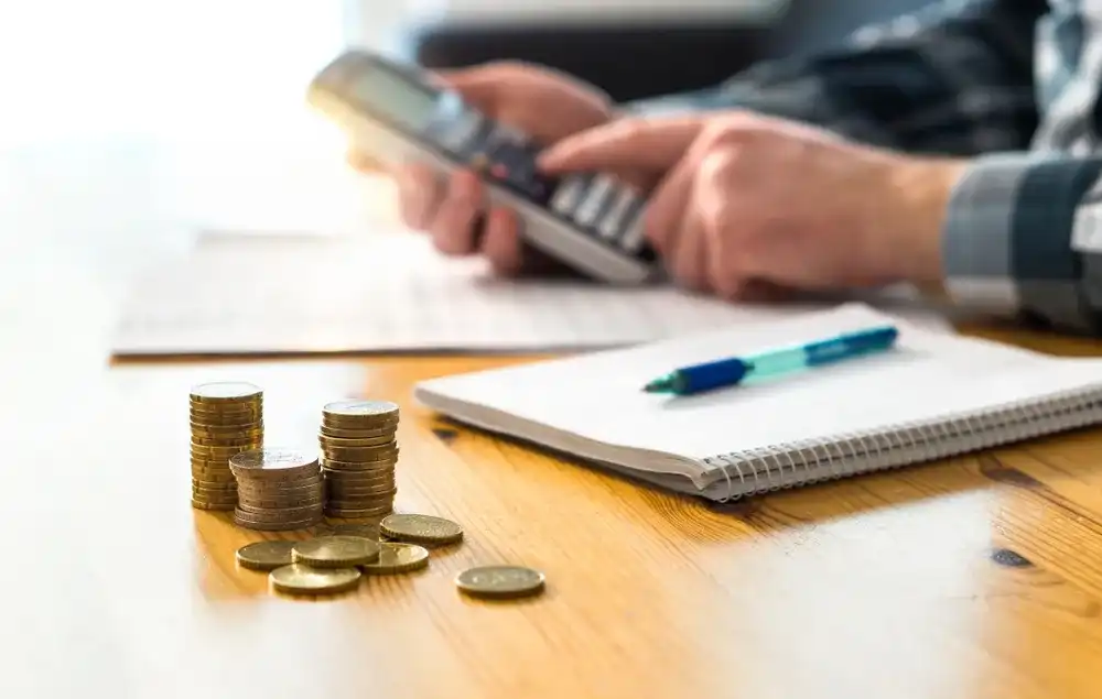 Person working on their interest rate with the rising rate of inflation