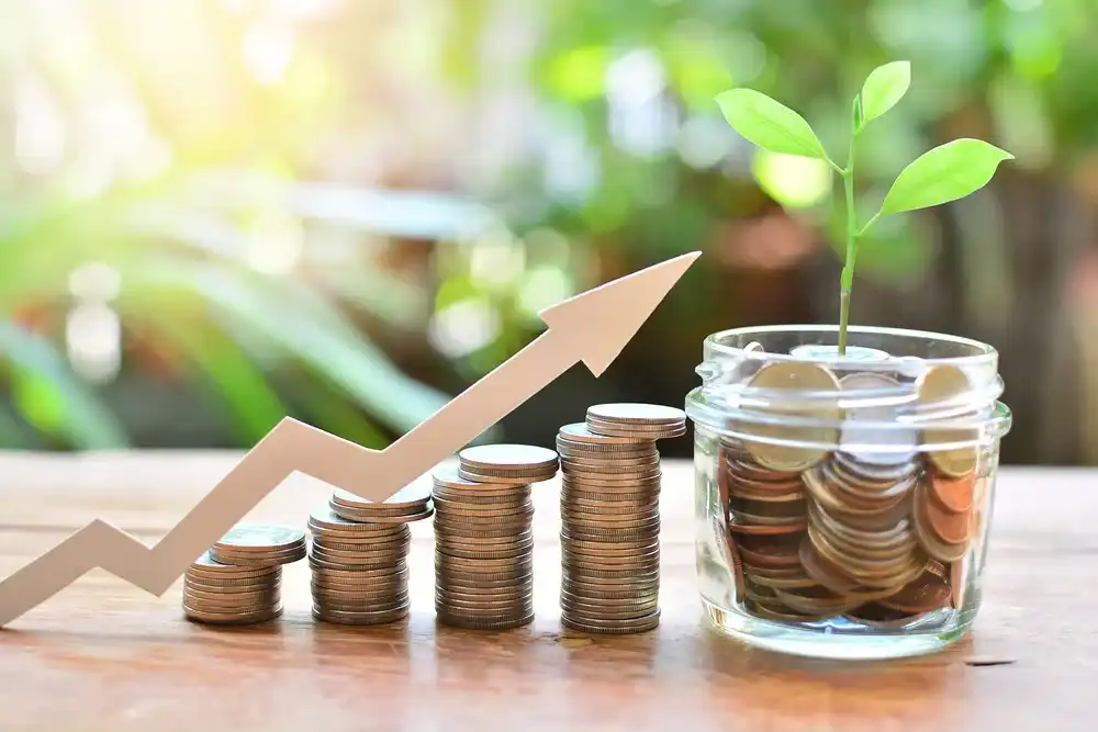Coins in a jar with a plant, representing steady savings