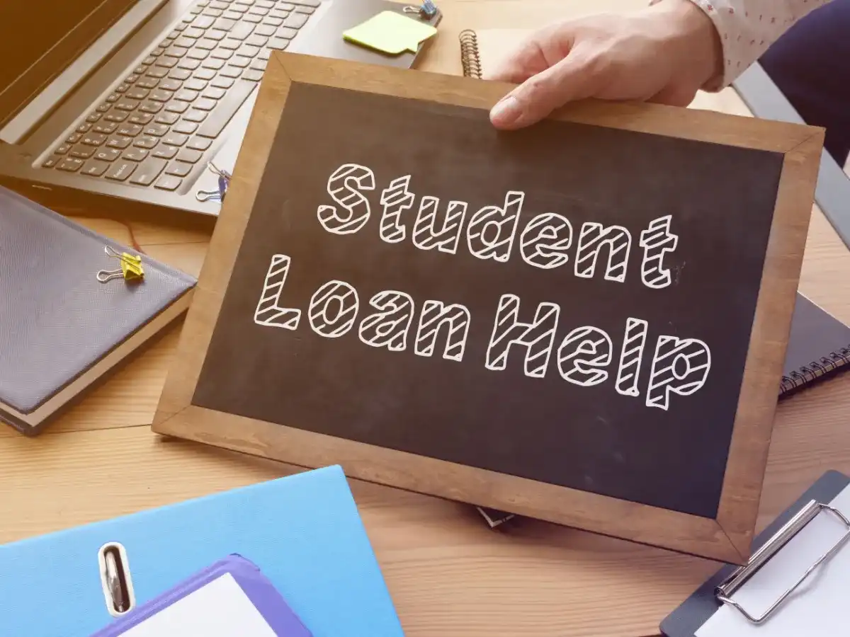 A chalkboard reading "Student Loan Help"