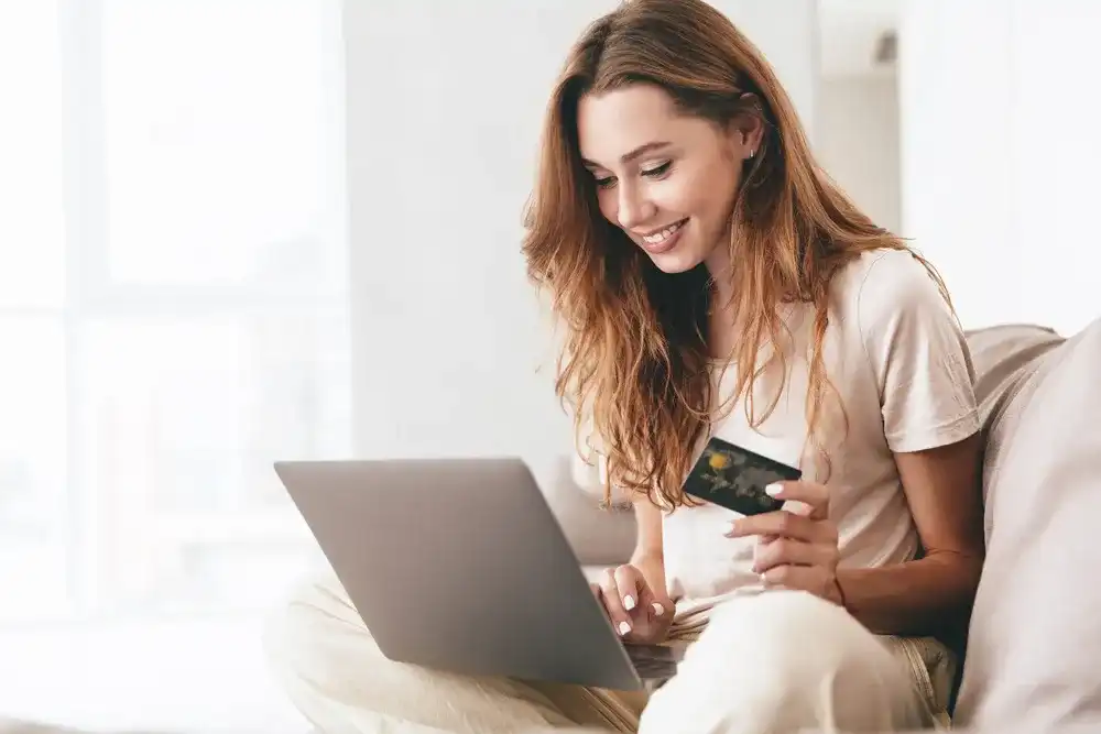 Woman using her credit card online