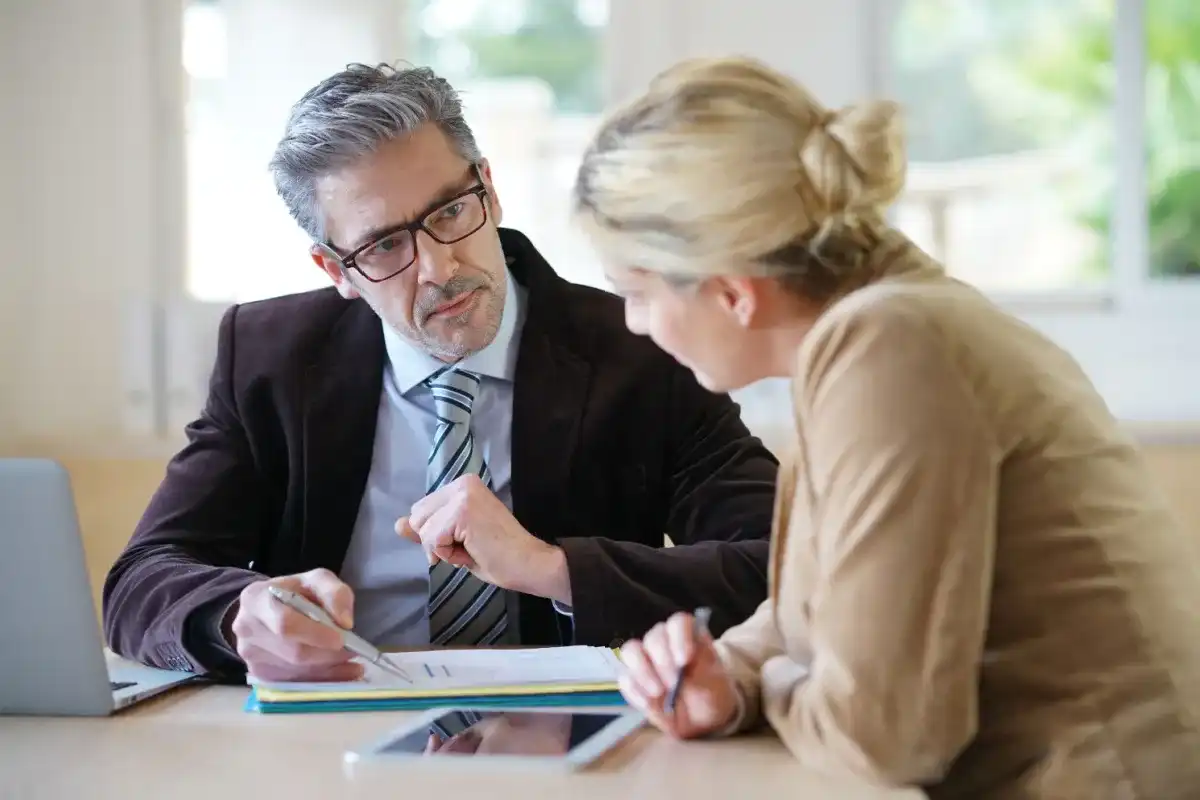 Person considering a title loan, weighing the potential risks against the benefits