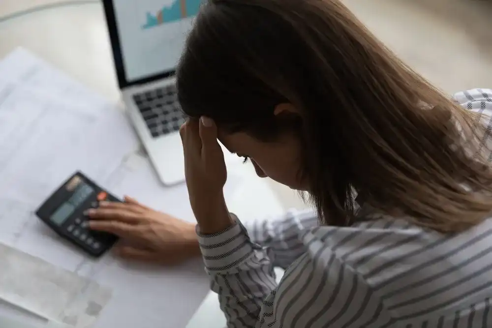 A woman trying to manage her financial stress