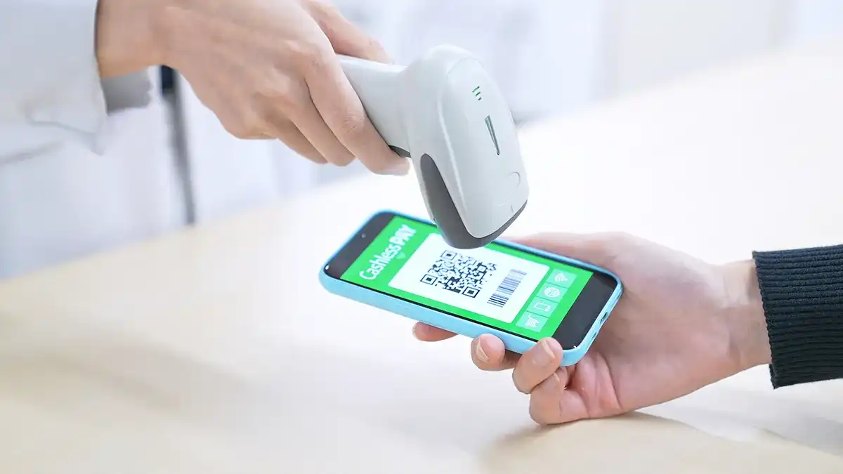A person getting their coupon app scanned on their phone