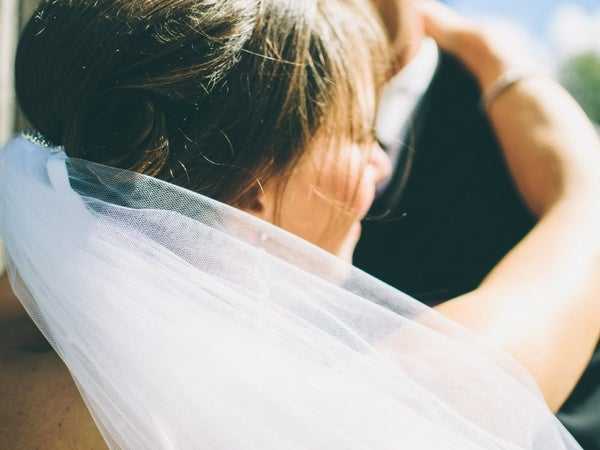 A bride and groom at their wedding that they paid for with a title loan 